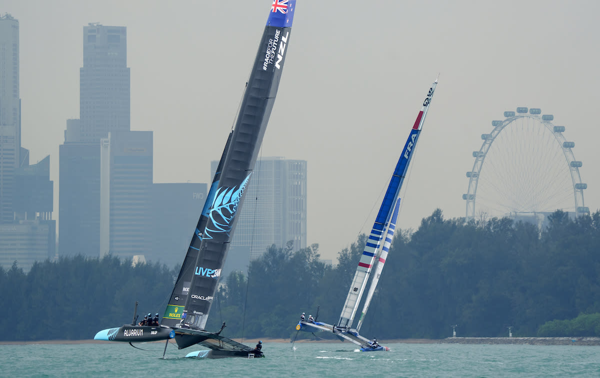 Team New Zealand (left) and Team France at Day Two of the Singapore Sail Grand Prix. (PHOTO: Bob Martin/SailGP)
