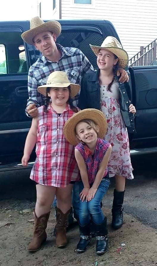 Chris Coletti with daughters Jasmine, Alexia and Mikeala. Coletti was shot and killed Nov. 1, and police are charging Garrito Fort with one count of felon in possession of a firearm in the shooting.