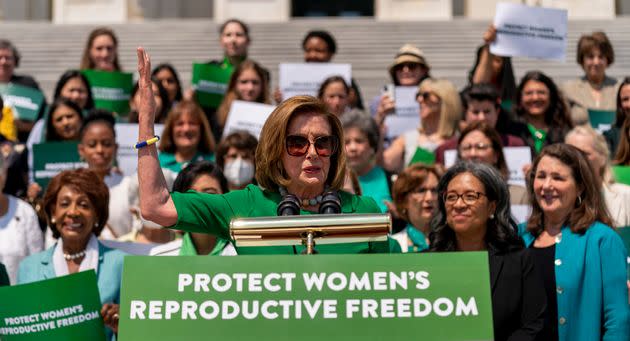 House Speaker Nancy Pelosi (D-Calif.) and other Democrats wore green on Friday in support of abortion rights. (Photo: via Associated Press)