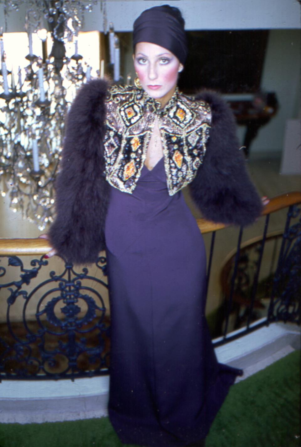 Cher poses for a portrait wearing an ornate costume.