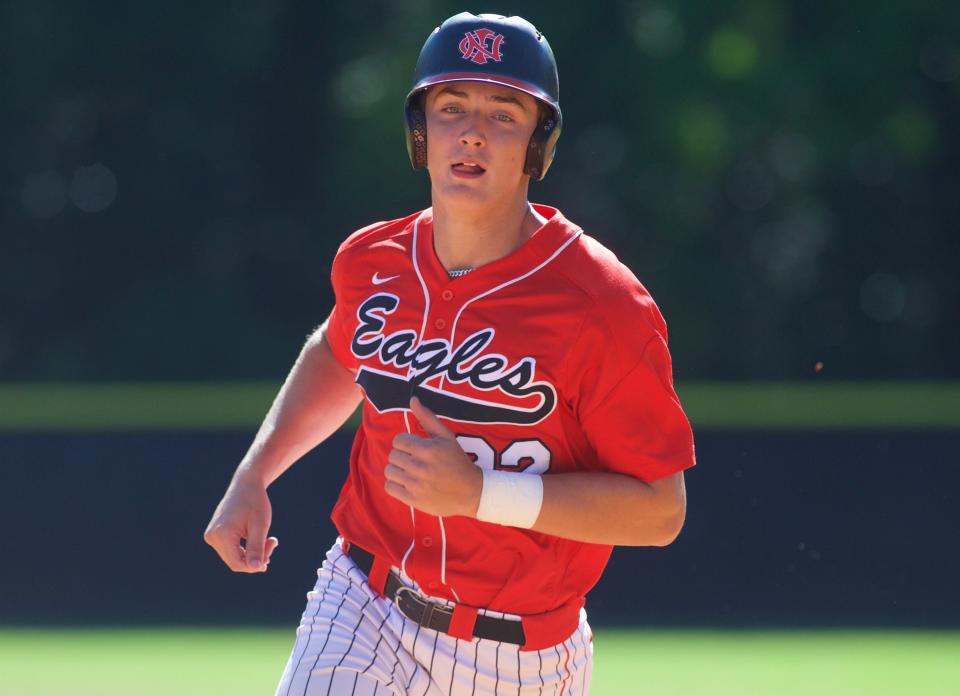 NFC junior Josh Schuchts (22) runs to third base in a game between North Florida Christian and Lincoln on April 17, 2023, at Posey Field. The Trojans won 6-1.