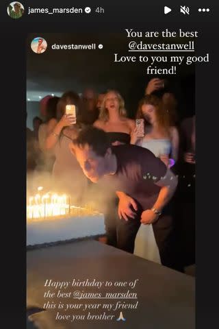 <p>James Marsden/ Instagram</p> James Marsden blows out the candles on his 50th birthday cake.