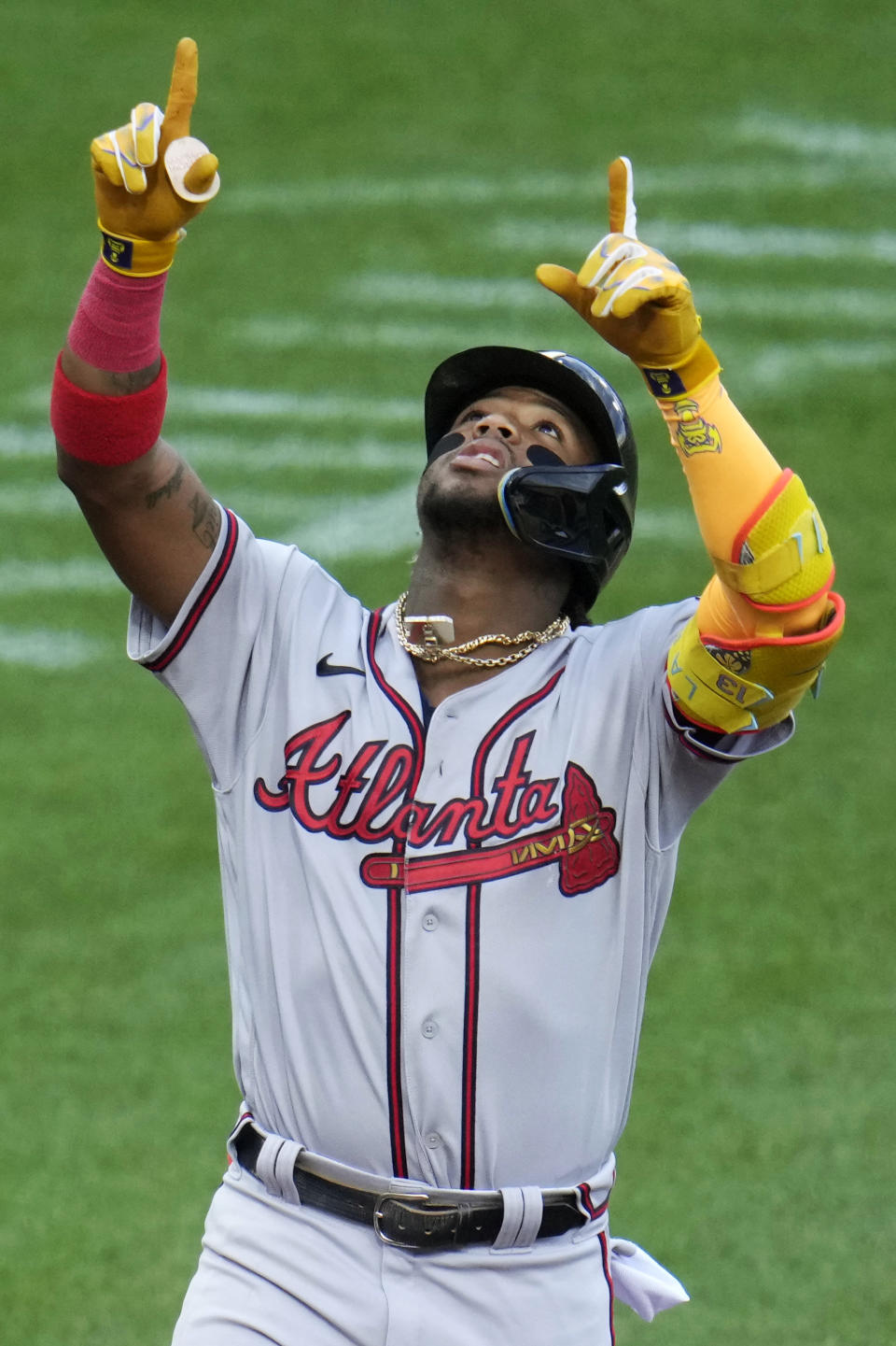 Atlanta Braves' Ronald Acuña Jr. celebrates as he crosses home plate on a solo home run off Pittsburgh Pirates starting pitcher Mitch Keller during the first inning of a baseball game in Pittsburgh, Tuesday, Aug. 8, 2023. (AP Photo/Gene J. Puskar)