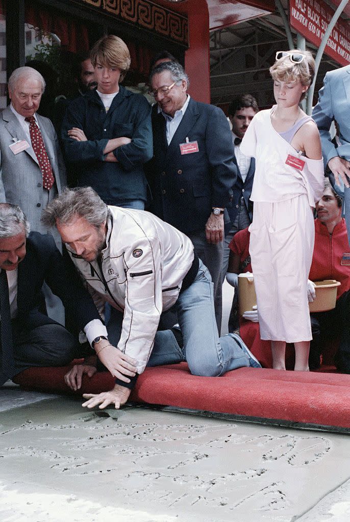 <p>In 1984, the actor received the honor of placing his handprints into the sidewalk at the Grauman's Chinese Theatre. His children, Kyle and Alison, look on. Later that year, Eastwood officially divorced their mother, after being separated for almost 20 years. </p>