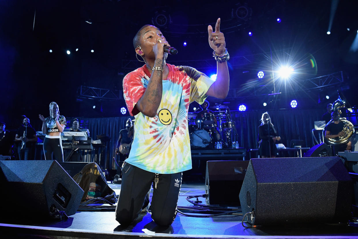 Unity: Pharrell Williams gets down on two knees in Charlottesville: Kevin Mazur/Getty Images