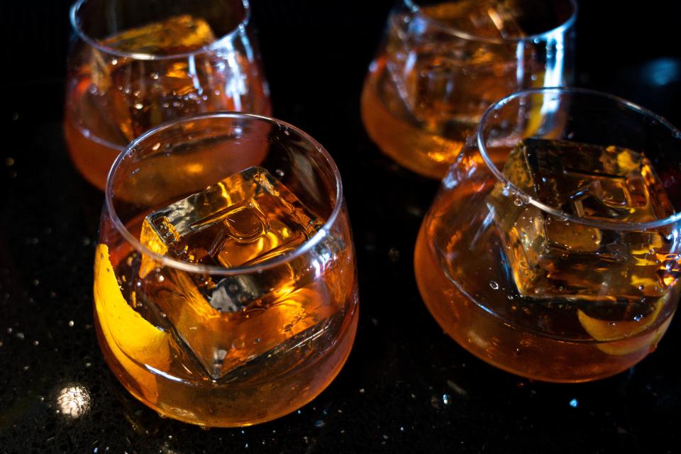 A Vibrant Old Fashioned, complete with a Red Room "R" stamp in the ice cube, is one of the cocktails inside the Red Room at Vibrant Music Hall.