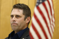 In this Tuesday, Oct. 15, 2019 photo, Virginia Del. Nick Freitas listens to an introduction during a town hall in Lake of Woods, Va. Freitas is running a write in campaign after a paperwork error left his off the November ballot. (AP Photo/Steve Helber)