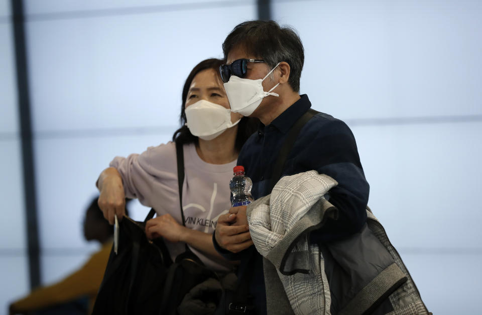 MADRID, SPAIN - MARCH 12: Travellers wear face masks as a precaution against coronavirus at Barajas Airport in Madrid, Spain on March 12, 2020. (Photo by Burak Akbulut/Anadolu Agency via Getty Images)