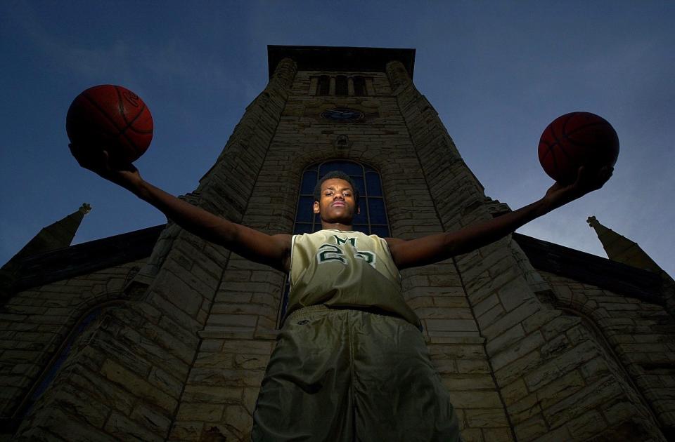 LeBron James poses March 19, 2001, as the Beacon Journal Player of the Year during his sophomore season at St. Vincent-St. Mary High School.