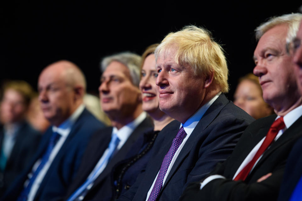 Foreign Minister Boris Johnson watches as Prime Minister Theresa May speaks at the Conservative Party Conference, at the Manchester Central Convention Complex in Manchester. Picture date: 4 October, 2017. Photo credit should read: Matt Crossick/ EMPICS Entertainment.