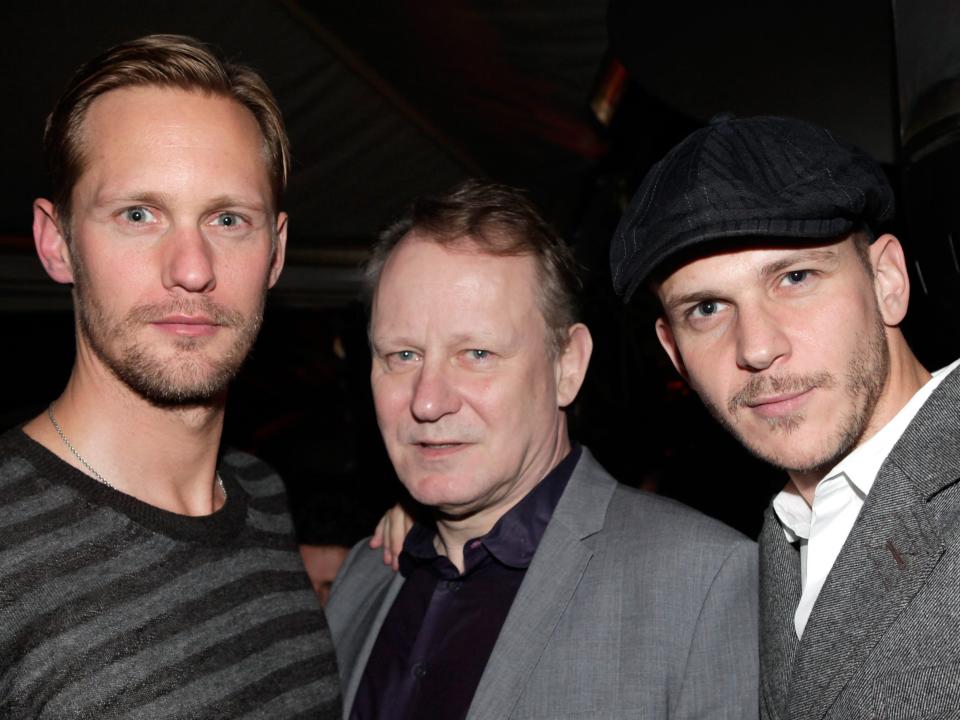 A young and tall Alexander with facial hair and blonde hair, an older Stellan with blonde hair, and a younger Bill with a hat and facial hair.