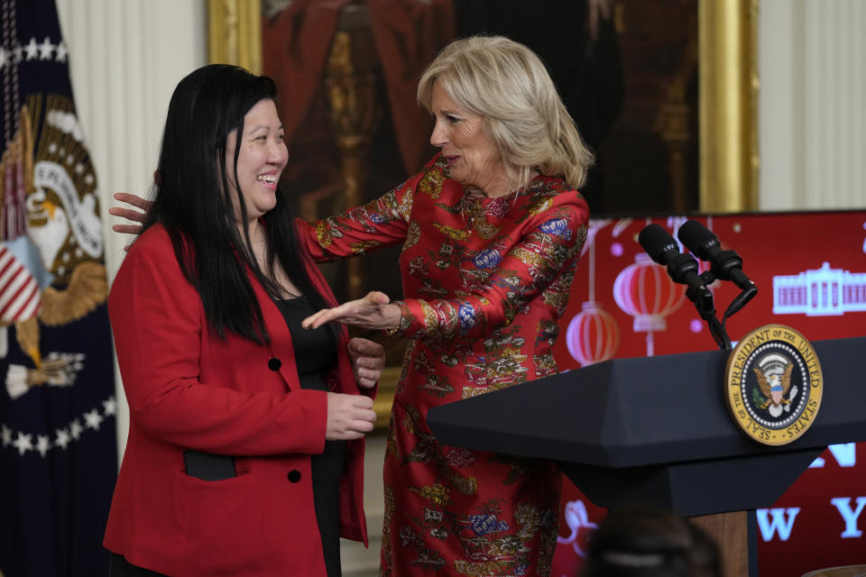 First lady Jill Biden introduces Elaine Tso, CEO of Asian Services in Action, to speak during a reception with President Joe Biden to celebrate the Lunar New Year in the East Room of the White House in Washington, Thursday, Jan. 26, 2023. (AP Photo/Susan Walsh)