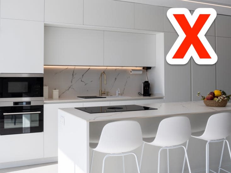 red x over a white minimalist kitchen