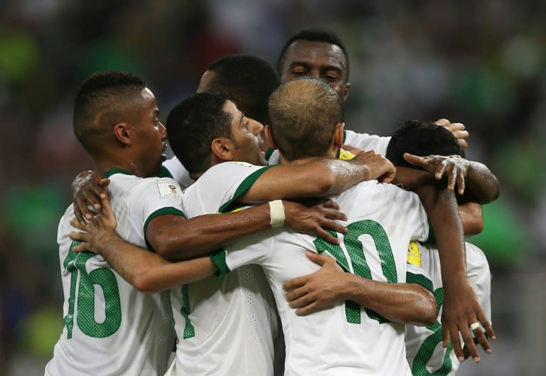 Saudi players celebrate their goal during the AFC qualifying football match for the 2018 FIFA World Cup between Saudi Arabia and United Arab Emirates on October 8, 2015 at the King Abdullah Sports City in Jeddah