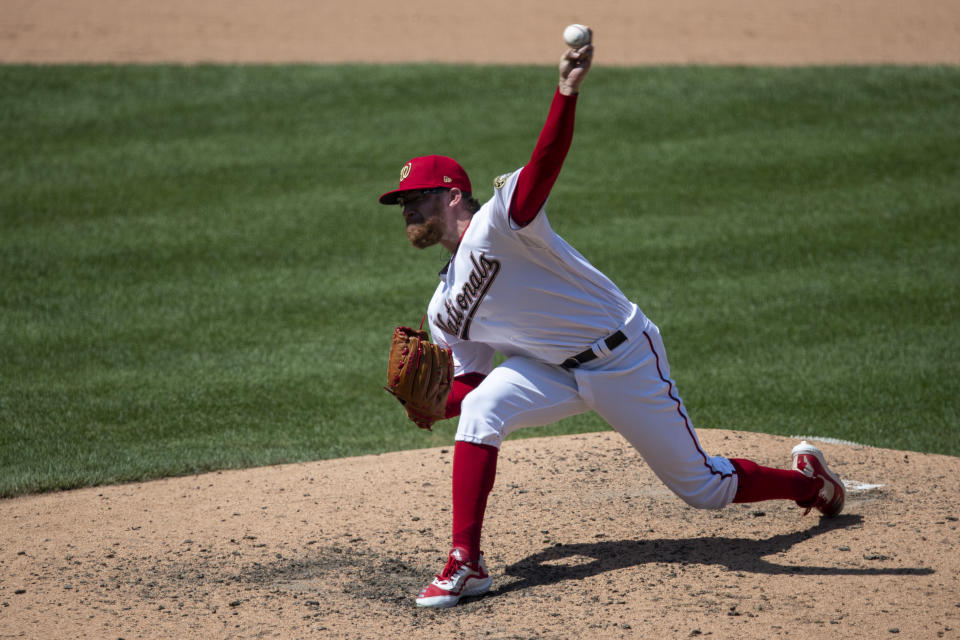 Washington Nationals relief pitcher Sean Doolittle throws during the eighth inning of a baseball game against the New York Yankees at Nationals Park, Sunday, July 26, 2020, in Washington. (AP Photo/Alex Brandon)