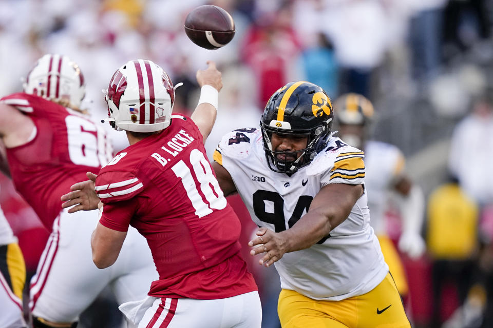 Iowa defensive lineman Yahya Black (94) rushes against Wisconsin quarterback Braedyn Locke (18) during the second half of an NCAA college football game Saturday, Oct. 14, 2023, in Madison, Wis. (AP Photo/Andy Manis)