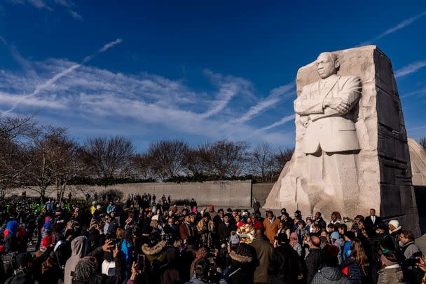 PHOTO: A large group gathers to watch a wreath-laying ceremony at the Martin Luther King Jr. Memorial on Martin Luther King Jr. Day in Washington, Jan. 16, 2023. (Andrew Harnik/AP)