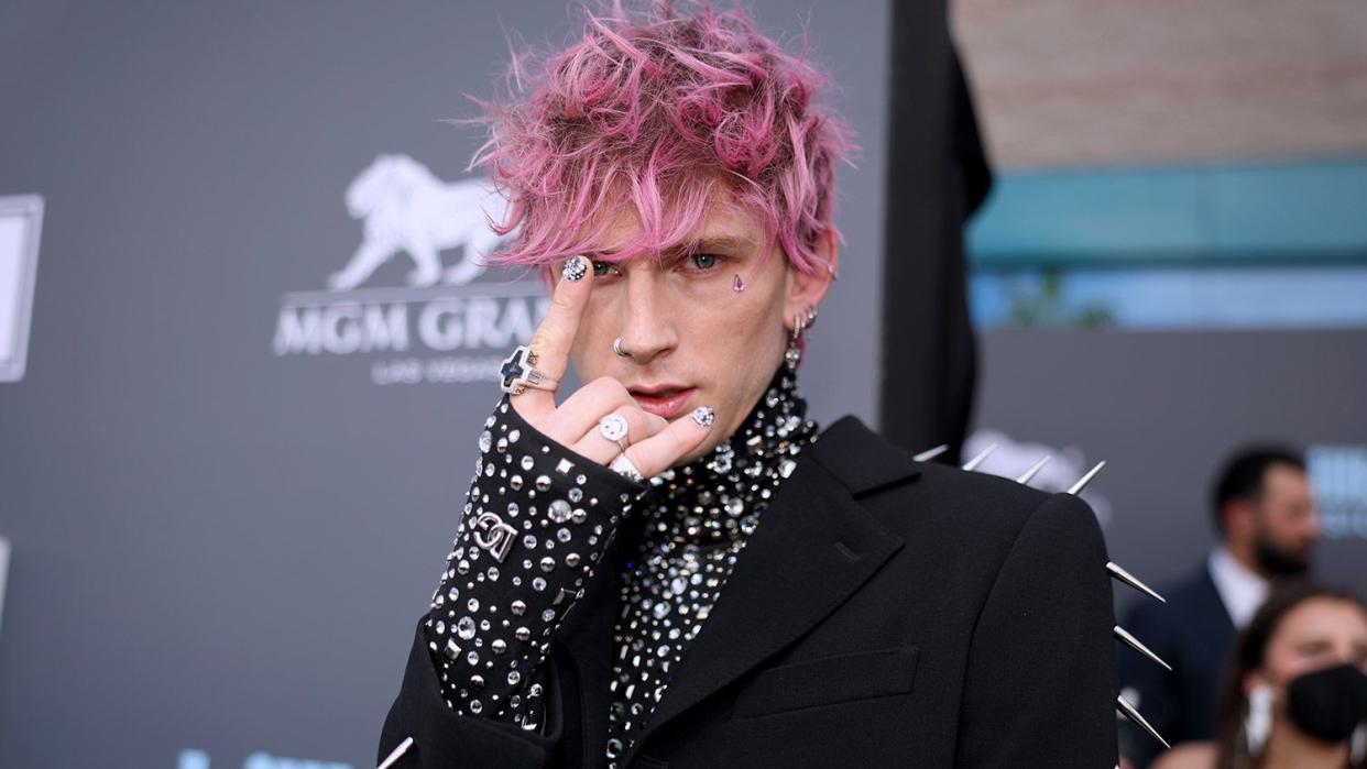 LAS VEGAS, NV - May 15: 2022 BILLBOARD MUSIC AWARDS -- Pictured: Machine Gun Kelly arrives to the 2022 Billboard Music Awards held at the MGM Grand Garden Arena on May 15, 2022. -- (Photo by Christopher Polk/NBC/NBCU Photo Bank via Getty Images)