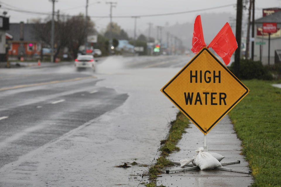 Heavy rain causes high water and flooding along Highway 101 in Tillamook, Ore., on Tuesday, Dec. 5, 2023. (Dave Killen/The Oregonian via AP)