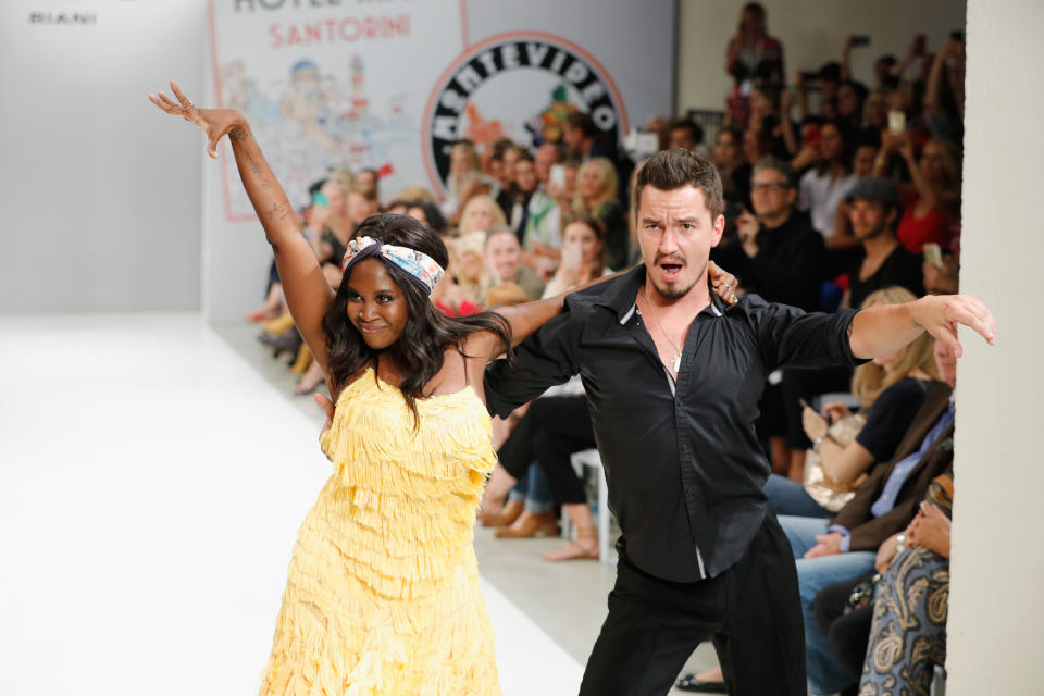 BERLIN, GERMANY - JULY 04:  Motsi Mabuse and Evgenij Voznyuk perform ahead the runway at the Riani Fashion Show Spring/Summer 2018 at Umspannwerk Kreuzberg on July 4, 2017 in Berlin, Germany.  (Photo by Andreas Rentz/Getty Images for Riani)