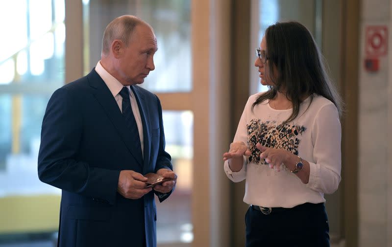 Russian President Putin visits a polling station during a nationwide vote on constitutional reforms in Moscow