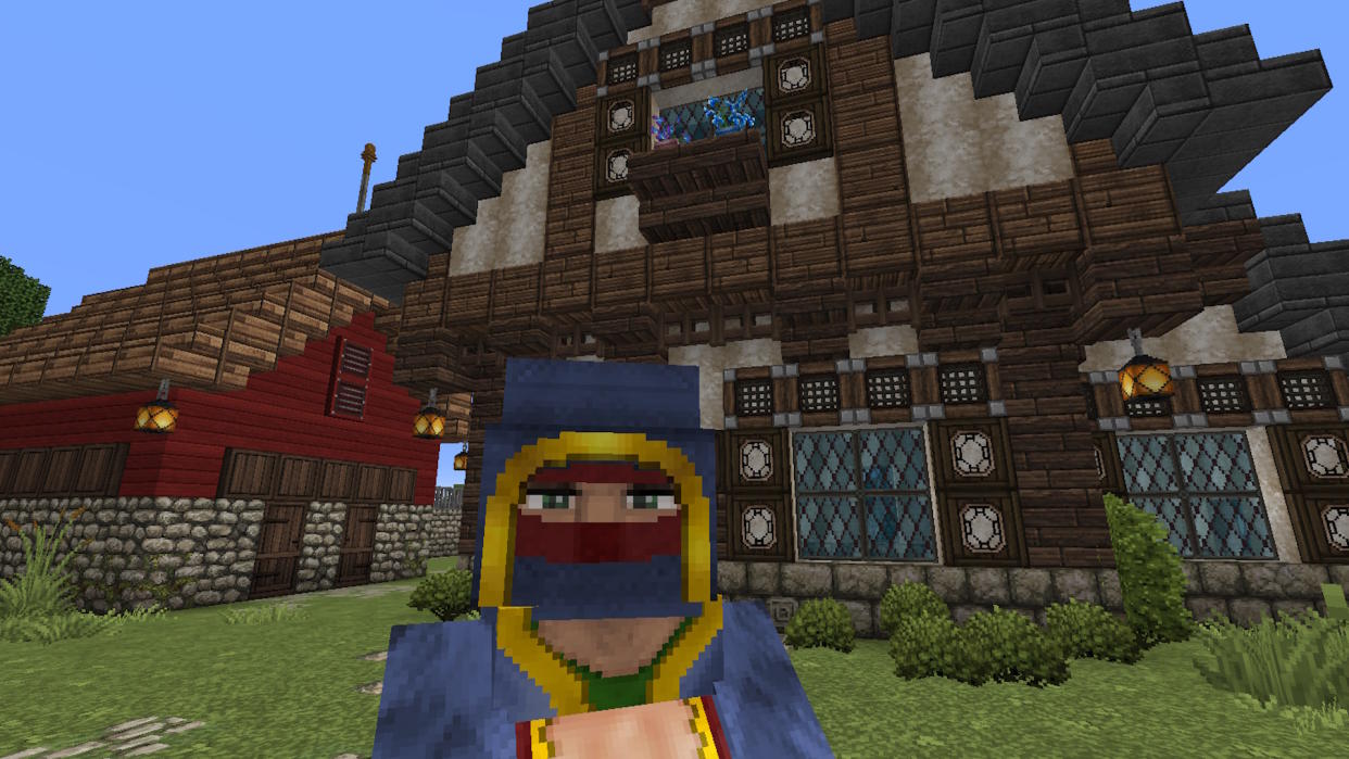  Minecraft texture packs - the John Smith Legacy pack showing a wandering trader in front of a tudor house. 