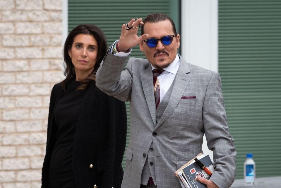 johnny depp walks outside during a court recess, in fairfax, during the days testimony in the civil trial between him and amber heard, thursday, may 26, 2022