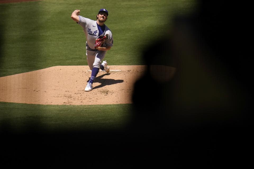 Dodgers starting pitcher Trevor Bauer delivers against the San Diego Padres in the first inning Sunday.