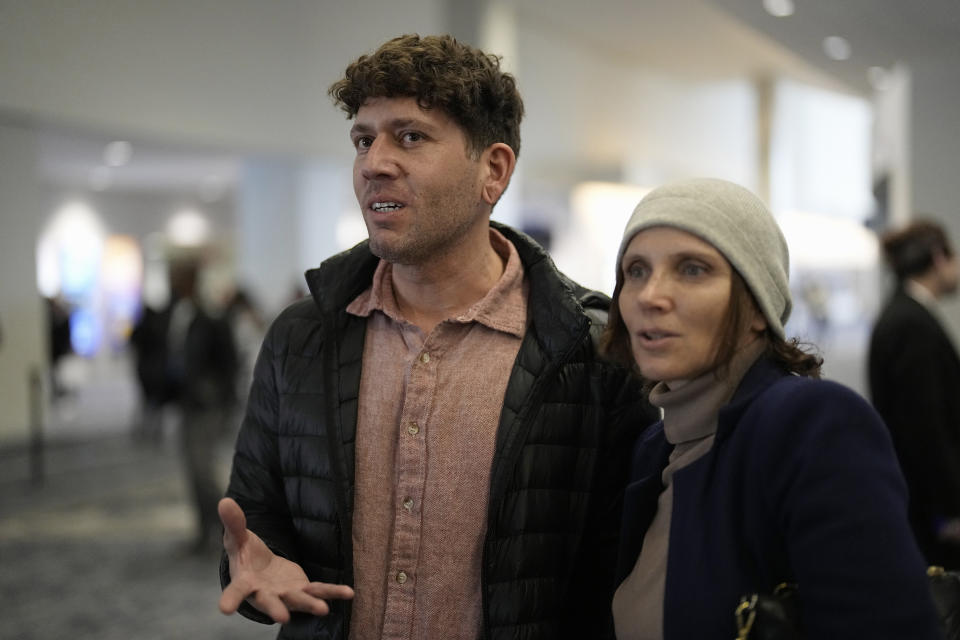 Richard Fijas, left, and Vera Andronenkova talk about traveling from Chicago to attend a service at Lakewood Church, Sunday, Feb. 18, 2024, in Houston. Pastor Joel Osteen welcomed worshippers back to Lakewood Church Sunday for the first time since a woman with an AR-style opened fire in between services at his Texas megachurch last Sunday. (AP Photo/David J. Phillip)