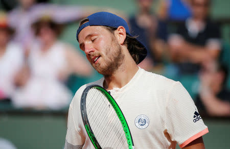 Tennis - French Open - Roland Garros, Paris, France - May 27, 2018 France's Lucas Pouille reacts during his first round match against Russia's Daniil Medvedev REUTERS/Pascal Rossignol