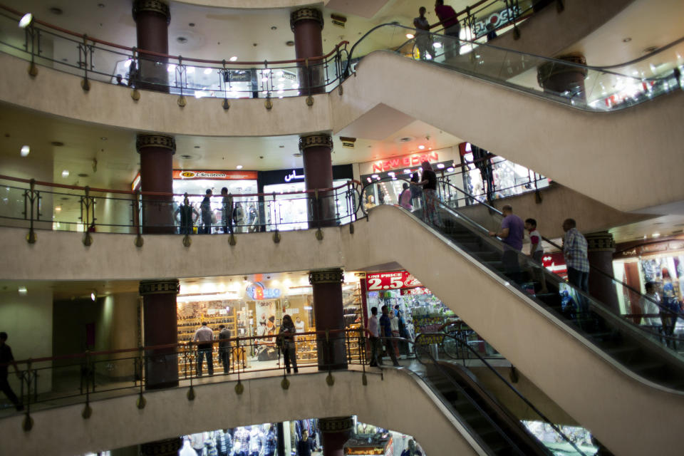 Egyptian shoppers roam a commercial mall in Cairo, Egypt, Wednesday, Oct. 31, 2012. Egypt’s capital prides itself on being city that never sleeps, with crowds filling cafes and shops open into the small hours. So the government is facing a backlash from businesses and the public as it vows to impose new nationwide rules closing stores and restaurants early. Officials say the crisis-ridden nation has to conserve electricity, but they also seem intent on taming a population they see as too unruly. (AP Photo/Nasser Nasser)