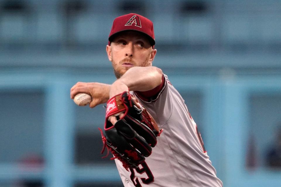 Arizona Diamondbacks starting pitcher Merrill Kelly throws to the plate during the first inning of a baseball game against the Los Angeles Dodgers Tuesday, May 17, 2022, in Los Angeles. (AP Photo/Mark J. Terrill)