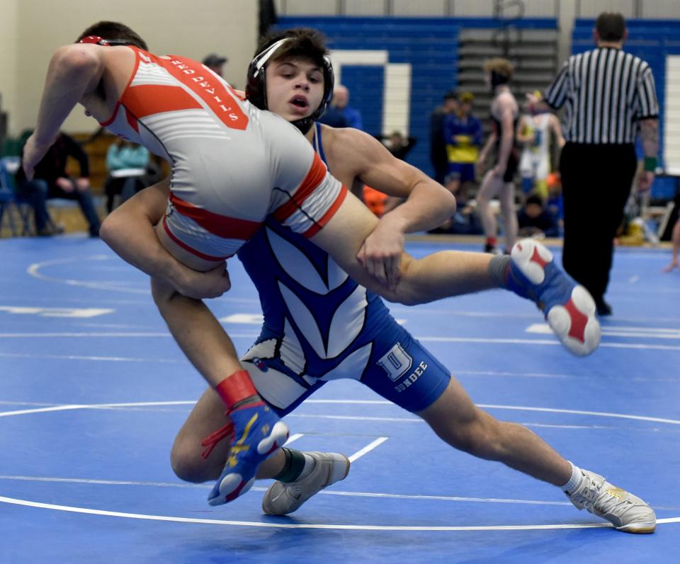 Dundee's Cameron Chinavare controls Sam Vesperman of Grosse Ile on the way to a pin in the 125-pound championship match of the Division 3 Individual District at Dundee Saturday.