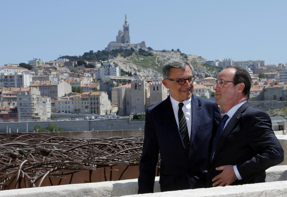 French President Francois Hollande, right, talks to MuCEM president Suzzarelli during his visit to the Museum of Civilizations from Europe and the Mediterranean (MuCEM) in Marseille, southern France, Tuesday June 4, 2013. The museum that cost over 200 million euros ($260 million), was inaugurated by French President Francois Hollande on Tuesday, and is the center piece of Marseille's turn as the European Capital of Culture for 2013, which aims to attract 10 million visitors this year. (AP Photo/Jean-Paul Pelissier, Pool)