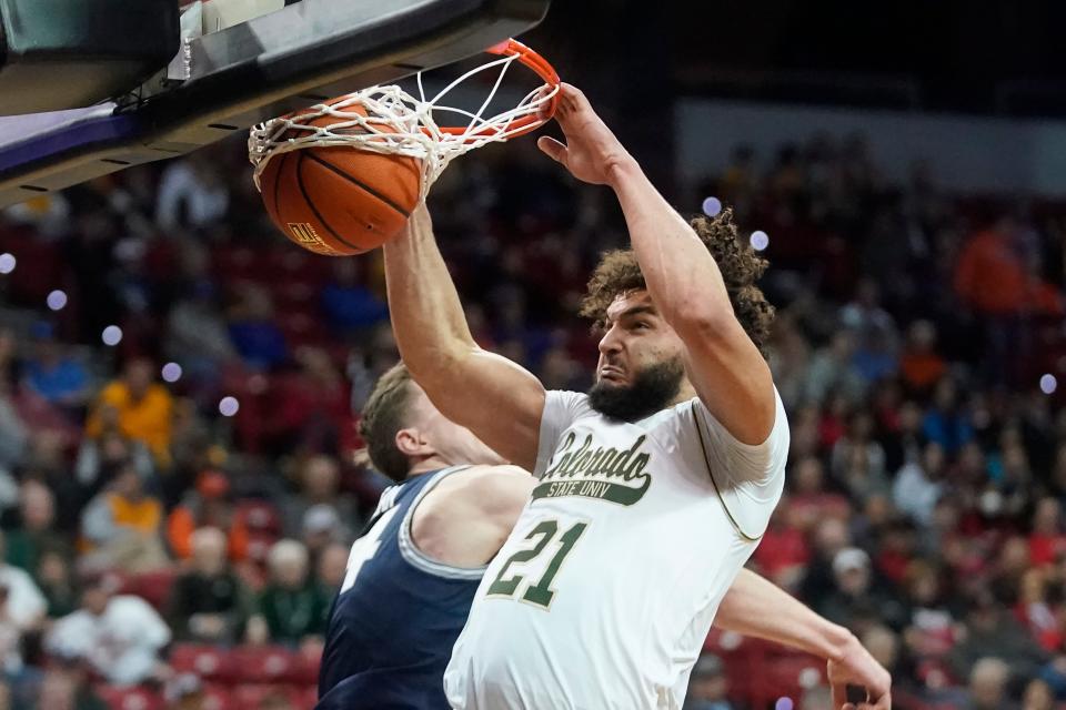 Colorado State guard David Roddy (21) dunks against Utah State during the second half of an NCAA college basketball game in the quarterfinals of Mountain West Conference men's tournament Thursday, March 10, 2022, in Las Vegas. (AP Photo/Rick Bowmer)