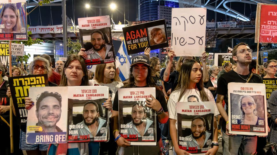 Relatives and supporters of Israeli hostages demand their release at a protest in Tel Aviv in April. - Faiz Abu Rmeleh/Middle East Images/AFP/Getty Images