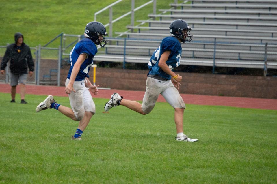 Hornets battle the elements during their annual Blue-Gold Scrimmage.