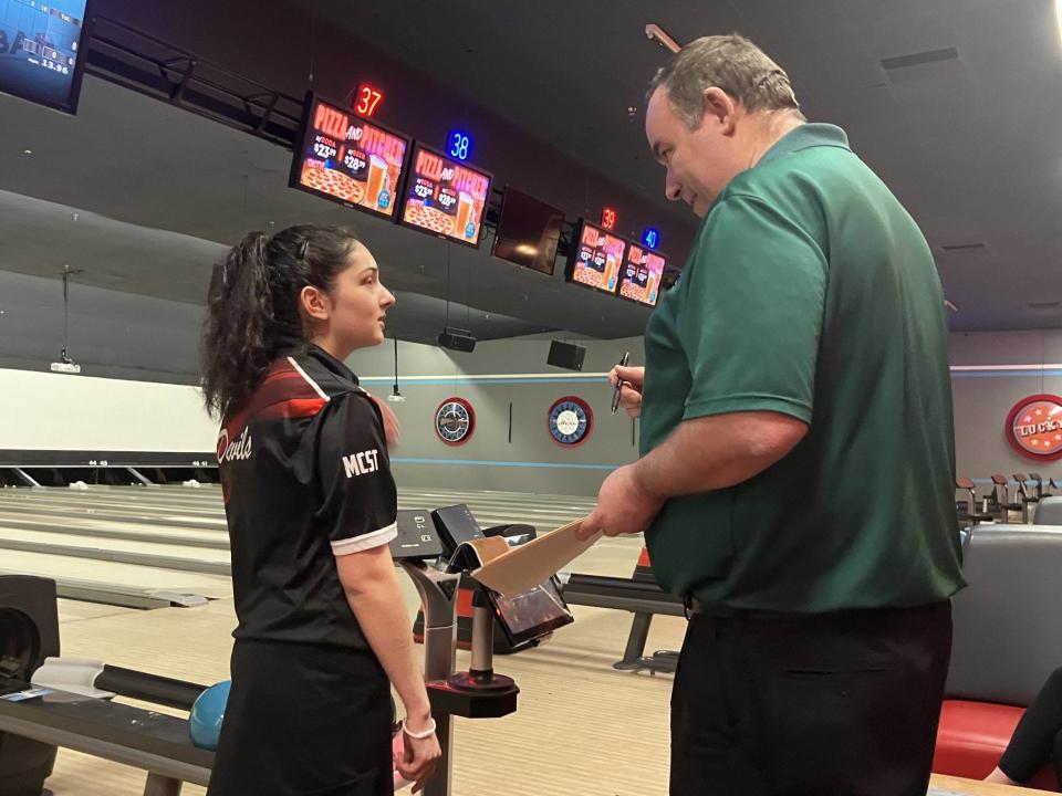 NJSIAA individual bowling finals at Bowlero North Brunswick on Thursday, Feb. 29, 2024. Morris Tech senior Amelia Lemanowicz receives instructions from girls tournament director John Canova prior to the stepladder semifinals.