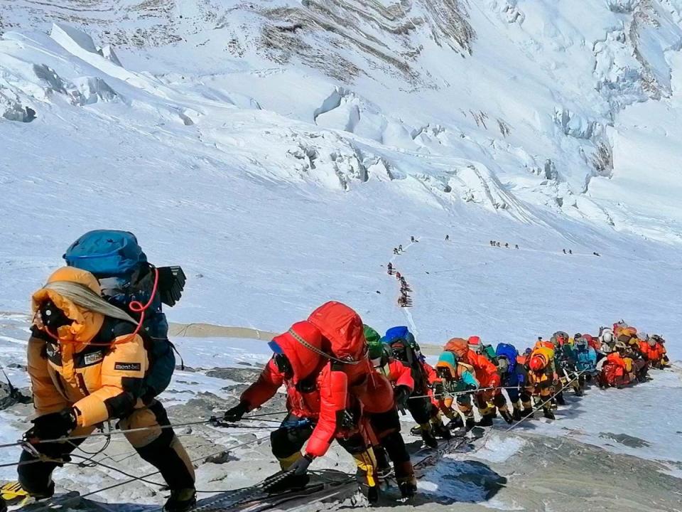 A long queue of mountain climbers line a path on Mount Everest just below camp four, in Nepal in 2019 (AP/Rizza Alee)