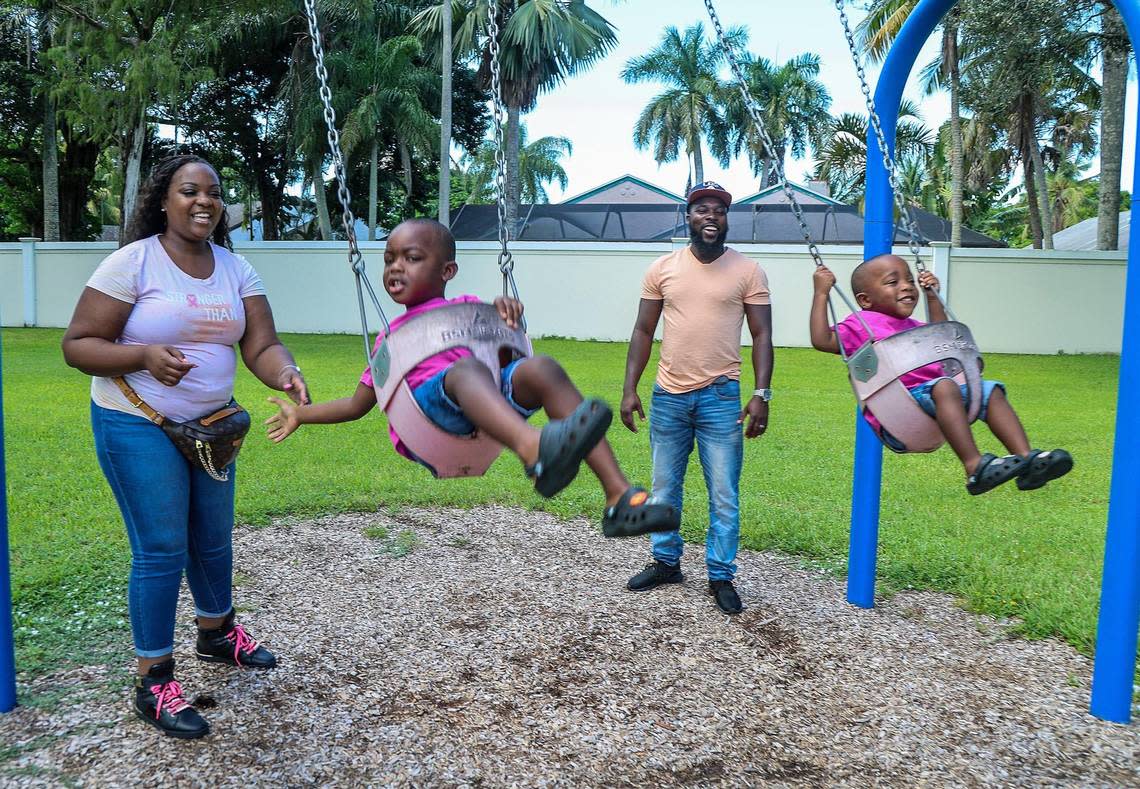 Jonise Louis and her husband Milien play with their kids Brayden (left), 4, and Giovanni, 2. at a park in Lauderhill., Florida, on Saturday, Oct. 7, 2023. She is a mother of two living with metastatic breast cancer. She found support from other pregnant women with breast cancer.