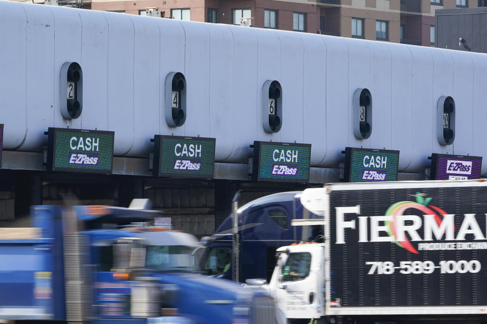 Cars pass through toll booths to use the George Washington Bridge in Fort Lee, N.J., Friday, July 8, 2022. The busy bridge connecting New Jersey and New York City is moving to cashless tolls. Beginning July 10, drivers paying cash tolls will have their license plates scanned and will be billed by mail. (AP Photo/Seth Wenig)