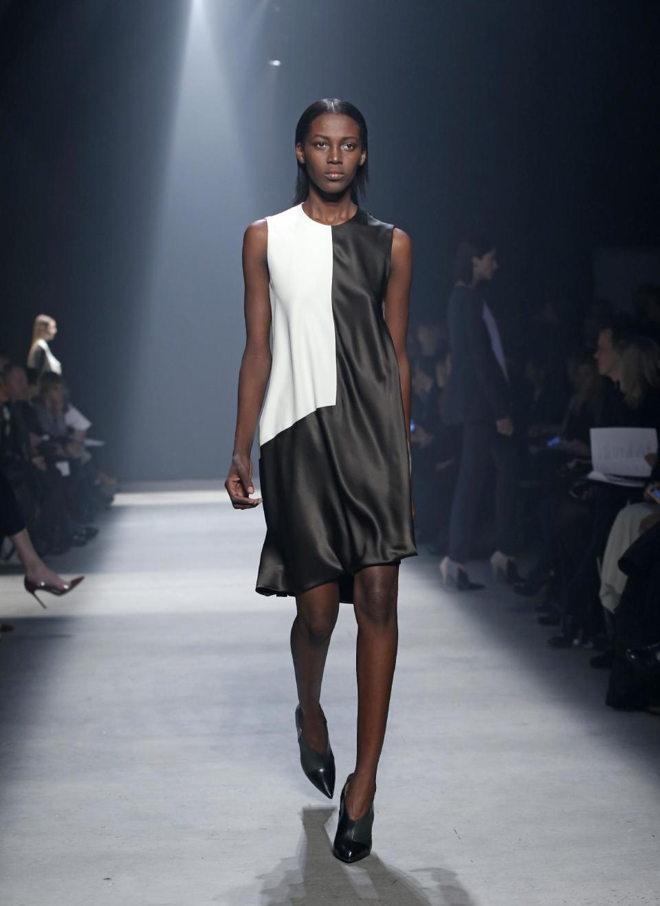 A model walks the runway during the showing of the Narciso Rodriguez Fall 2014 collection at Fashion Week in New York, Tuesday, Feb. 11, 2014. (AP Photo/Kathy Willens)