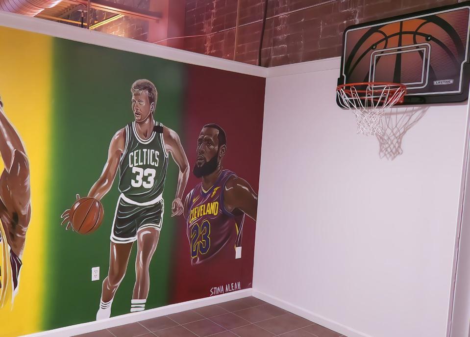The NBA star studio includes Lebron James during his stint with the Cleveland Cavaliers, Boston Celtics great Larry Bird and an actual basketball hoop. The murals were painted by Stina Aleah. There are pictures of LA Lakers great Kobe Bryant and Michael Jordan of the Chicago Bulls, as well.