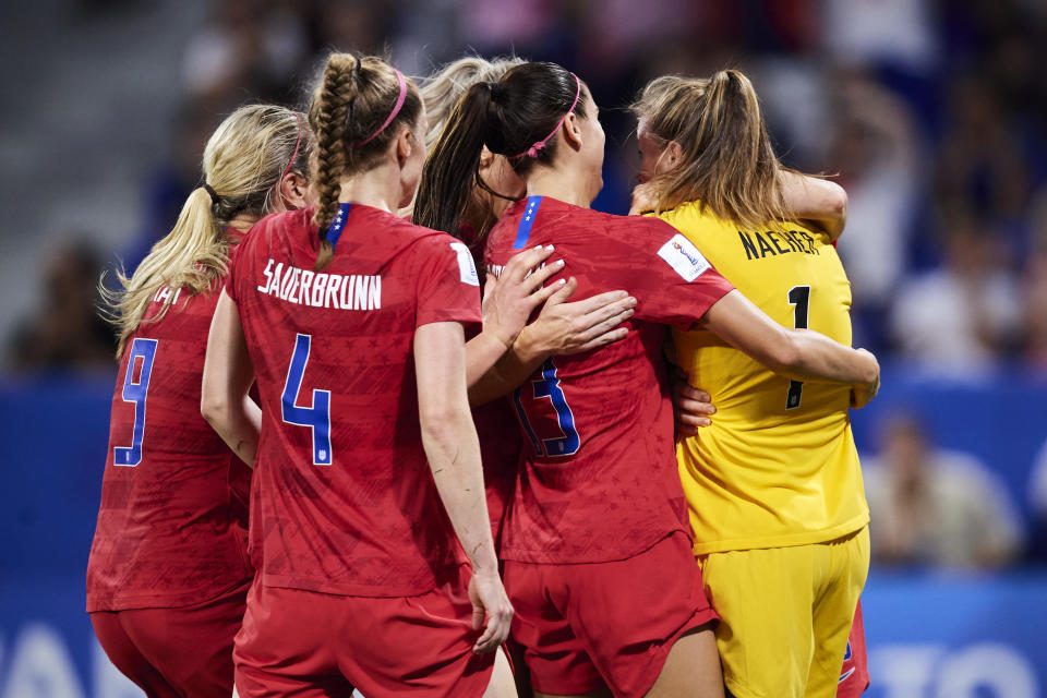 LYON, FRANCE - JULY 02: Players of USA congrats Alyssa Naeher for saving the penalty during the 2019 FIFA Women's World Cup France Semi Final match between England and USA at Stade de Lyon on July 02, 2019 in Lyon, France. (Photo by Quality Sport Images/Getty Images)