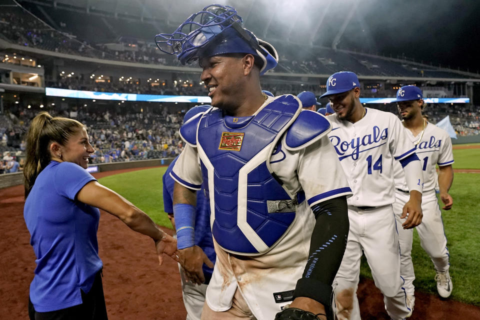 Kansas City Royals' Salvador Perez, Edward Olivares (14) and MJ Melendez (1) walk off the field after their baseball game against the New York Mets Wednesday, Aug. 2, 2023, in Kansas City, Mo. The Royals won 4-0. (AP Photo/Charlie Riedel)