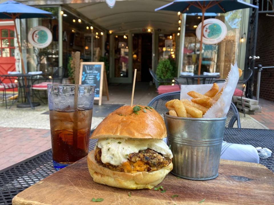 The veggie burger at Under the Moon is a must try with its goat cheese aioli.