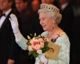 <p>Queen Elizabeth II waves to a crowd following an evening gala as part of her Golden Jubilee celebrations in Toronto. (Photo by J.P. Moczulski/AFP via Getty Images)</p> 