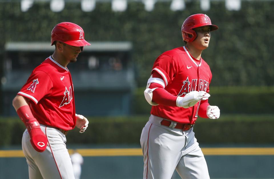 Shohei Ohtani of the Los Angeles Angels celebrates after hitting a two-run home run that scored Zach Neto #9 (L) against the Detroit Tigers during the second inning of game two of a doubleheader at Comerica Park on July 27, 2023 in Detroit, Michigan.