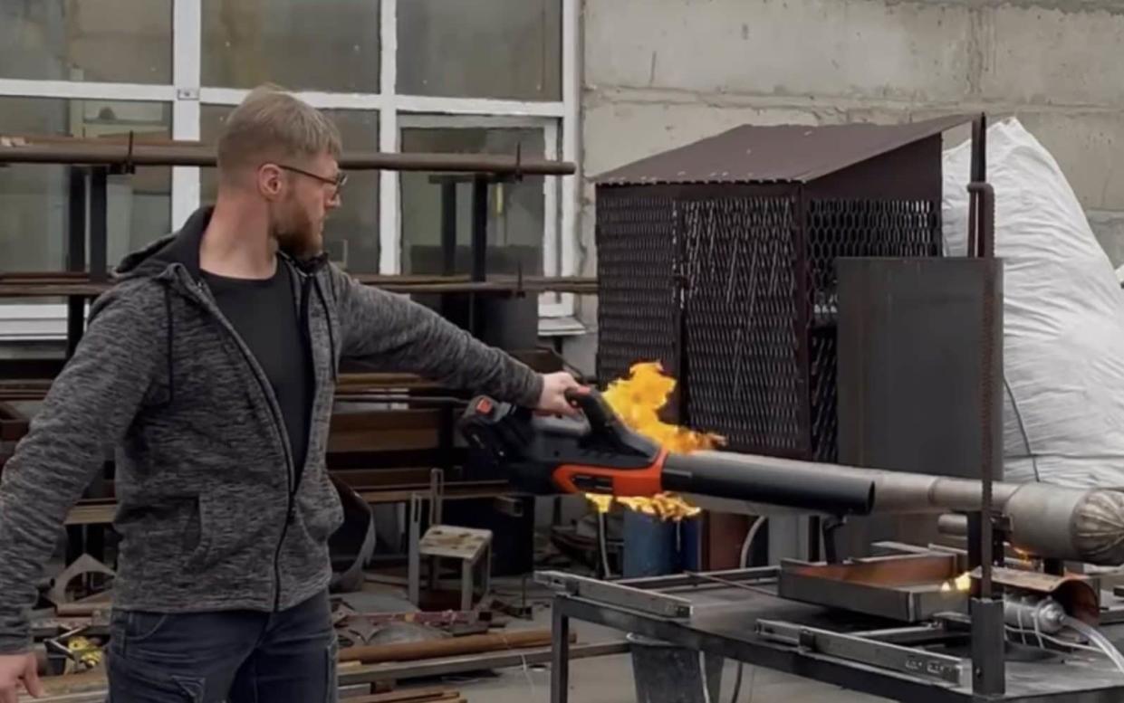 Man applies flame to the rocket tube