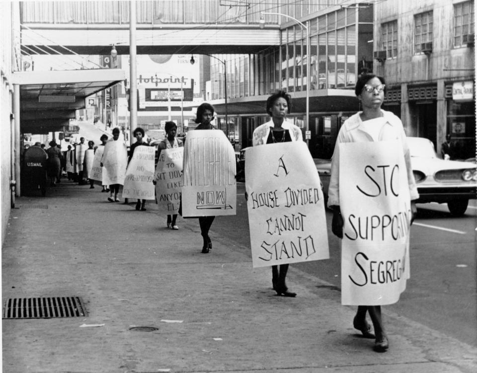 FILE - Black activists are seen picketing outside Rich's department store protesting against segregated eating facilities at one of its lunch counters in Atlanta, Oct. 19, 1960. The activists who had taken seats inside the store were arrested. Following the publication of "An Appeal for Human Rights," March 9, 1960, students at Atlanta's historically Black colleges waged a nonviolent campaign of boycotts and sit-ins protesting segregation at restaurants, theaters, parks and government buildings. (AP Photo/File)
